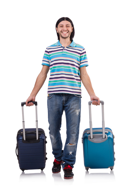 Young man travelling with suitcases isolated on white - Foto, afbeelding