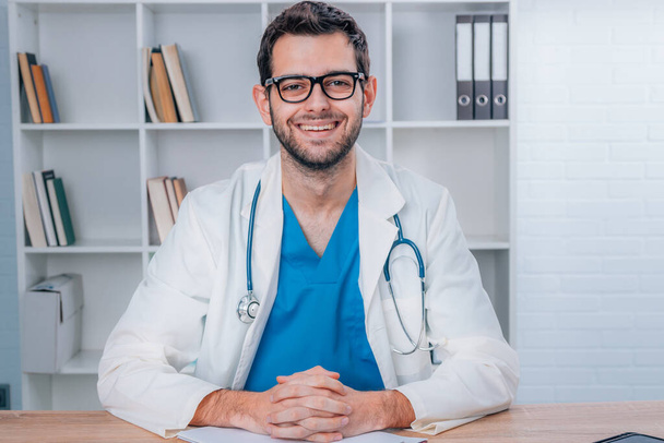attractive young doctor with uniform and stethoscope working - Photo, Image