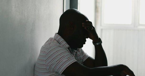 Troubled African man suffering from depression. Black guy feeling stress - Fotoğraf, Görsel