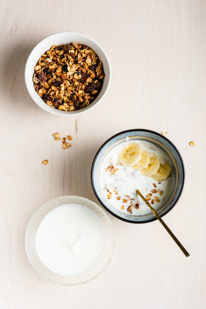 Granola with yogurt and bananas, top view. - Φωτογραφία, εικόνα
