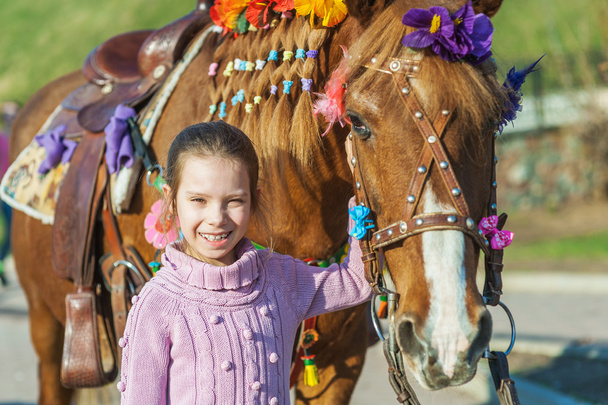 Little girl with festive horse - Photo, Image