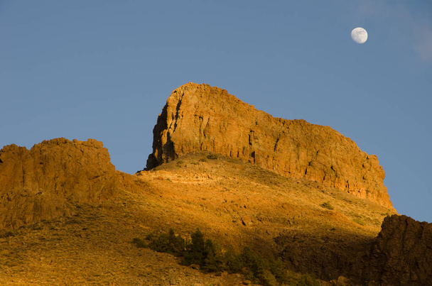 Cliff Sombrero de Chasna and moon. - Photo, Image