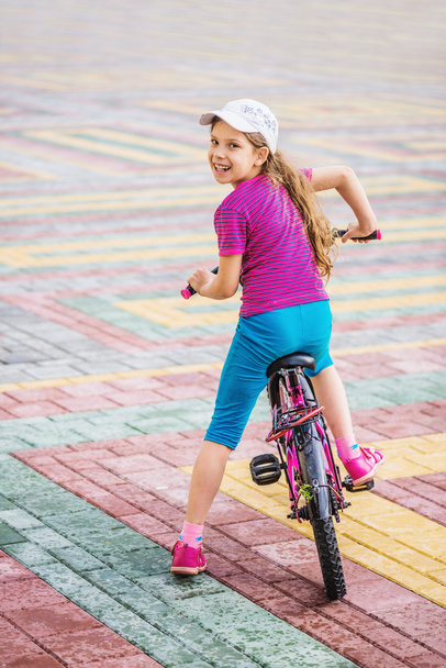 little girl riding bicycle - 写真・画像