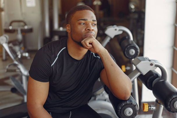 A handsome black man is engaged in a gym - Fotoğraf, Görsel
