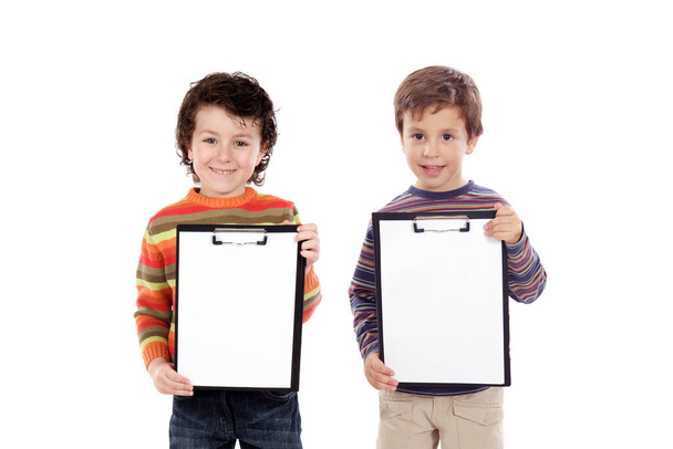 Two funny children holding clipboards isolated on a white background - Valokuva, kuva
