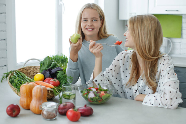 Healthy food woman. Girls girlfriend eats a salad. - Photo, Image