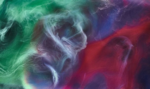 Green pink smoke on black ink background, colorful fog, abstract swirling touch ocean sea, acrylic paint pigment underwater - Foto, afbeelding