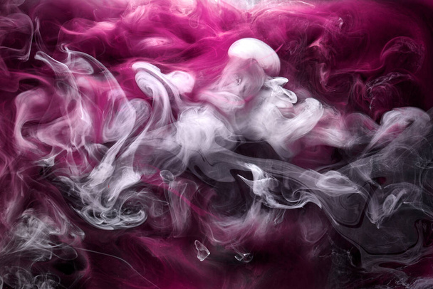 Multicolor pink smoke on black ink background, colorful fog, abstract swirling touch ocean sea, acrylic paint pigment underwater - Photo, Image