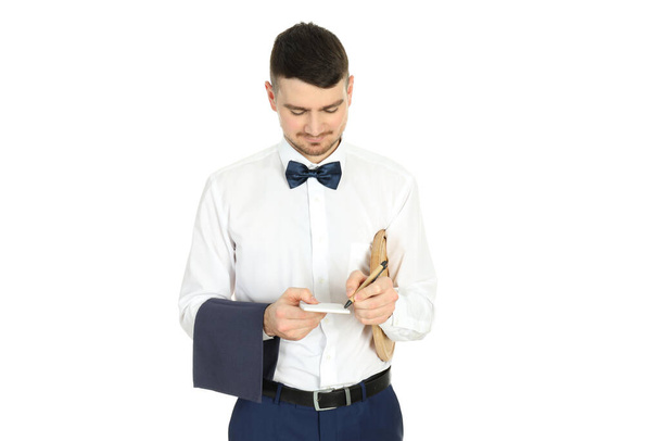 Young man waiter isolated on white background - Фото, изображение