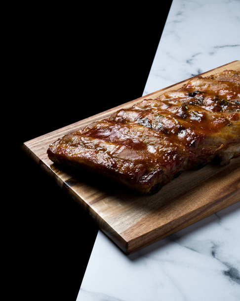 BBQ Ribs piece with olive oil, garlic powder and parsley - Photo, Image