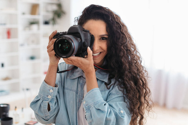 Professional Photographer Lady Taking Photo Smiling Holding Photocamera Standing Indoors - Fotoğraf, Görsel