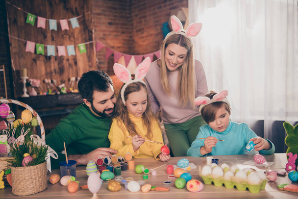 Portrait of beautiful handsome cheerful family preparing domestic party festal event draw eggs indoors - Fotoğraf, Görsel