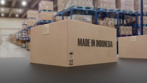 Cajas con texto MADE IN INDONESIA sobre transportador. Indonesia productos relacionados animación en 3D loopable - Metraje, vídeo