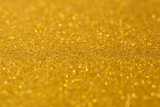 λάμπει ομοιόμορφο φόντο της χρυσής άμμου, χρωματιστό χαρτί άμμο υφή φόντο - Φωτογραφία, εικόνα