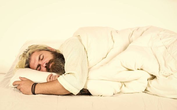 Relaxing at home. tiredness of insomnia. brutal bearded hipster relax at home. cozy white bedroom. early wake up. lazy sunday. morning sex concept. mens health. man in bathrobe sleep in bed - Fotoğraf, Görsel