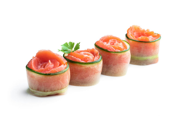 Salmon  rolls with cucumber slice isolated on white  - Fotoğraf, Görsel