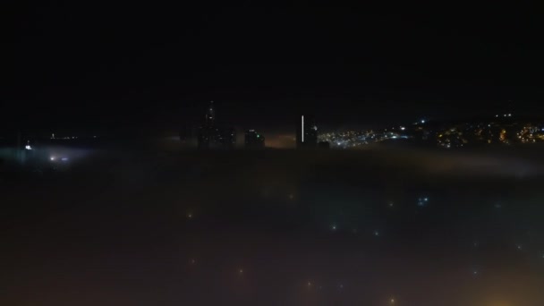 8K 7680x4320.Houses and streets in the city are under the mist.Street lamp lights in mist.Weather opposition negatively affecting life at night.City town street road centrum building house metropolis. - Footage, Video