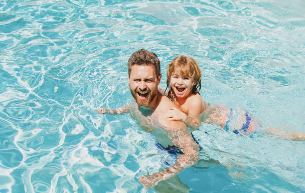 Dad and son swimming lessons. Pool party. Family summer weekeng. Fathers Day. - Fotografie, Obrázek