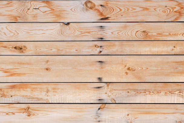Wooden background of horizontal pine boards covered with knots - Foto, Imagem