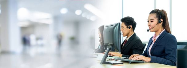 Business people wearing headset working in office in broaden view - Фото, изображение