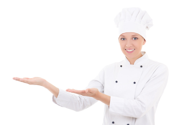 young woman chef showing or presenting something isolated on whi - Photo, image
