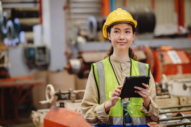 Asian working woman worker, portrait smile engineer lady standing with tablet. - Fotó, kép