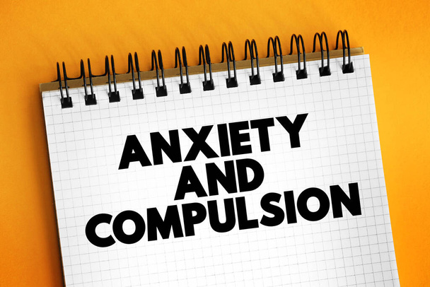 Anxiety and Compulsion text concept on notepad for presentations and reports - Fotografie, Obrázek
