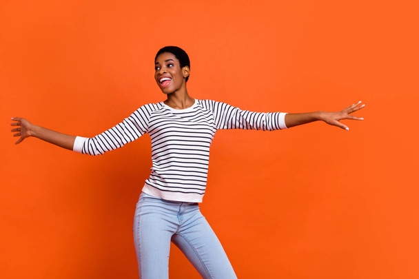 Photo of pretty charming butch lady dressed sweater dancing smiling isolated orange color background - Fotografie, Obrázek
