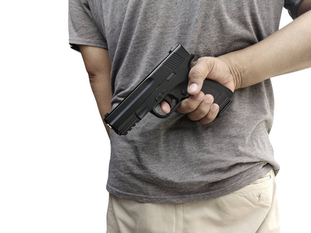 Άντρας κρατώντας ένα όπλο στο χέρι του με λευκό φόντο - Φωτογραφία, εικόνα