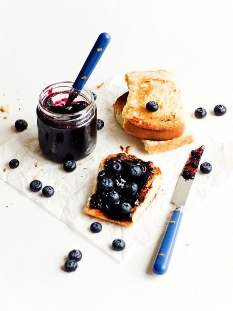 White bread toasts with blueberry jam. Shallow dof. - Zdjęcie, obraz