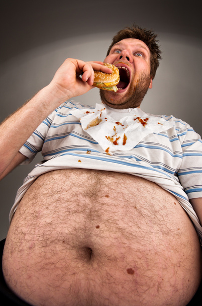 Gordo comendo hambúrguer
 - Foto, Imagem