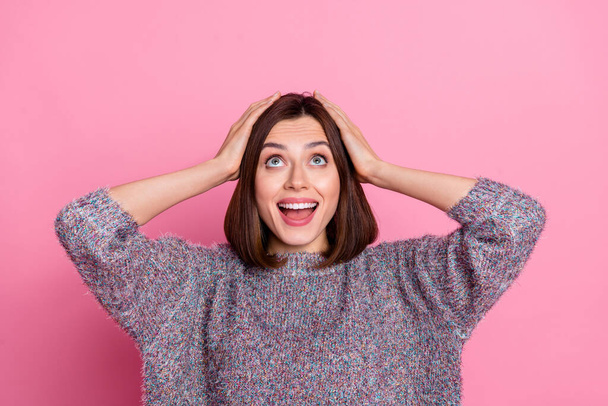 Portrait of attractive cheerful amazed girl looking up copy space sale isolated over pink pastel color background - 写真・画像