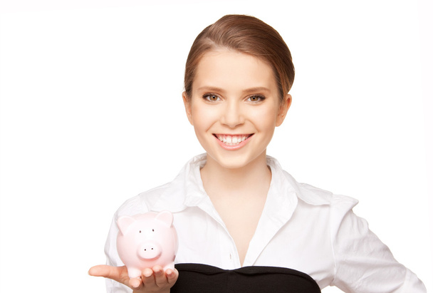 Lovely woman with piggy bank - Photo, image