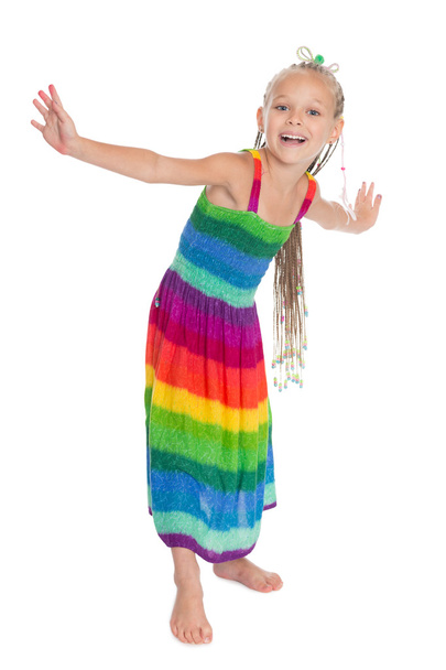 Cheerful little girl in a beautiful dress - Фото, зображення