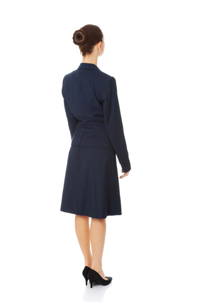 Businesswoman standing back - Foto, imagen
