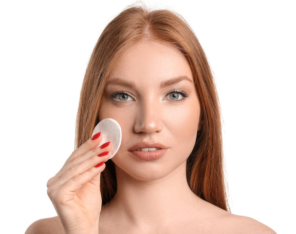 Beautiful woman with makeup sponge on white background - Photo, Image
