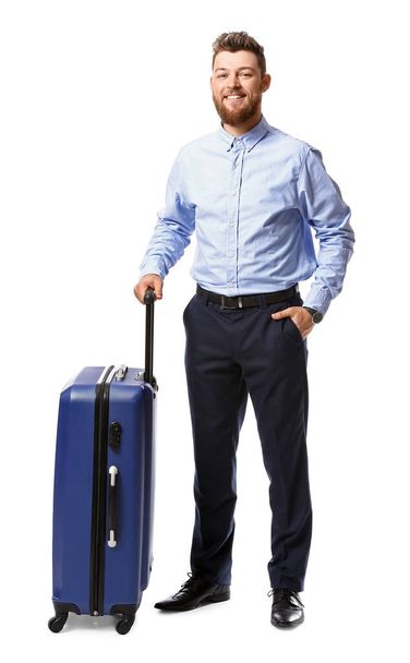 Bonito homem de negócios com mala azul no fundo branco - Foto, Imagem