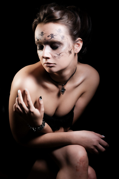 Young girl with artistic makeup - Fotó, kép