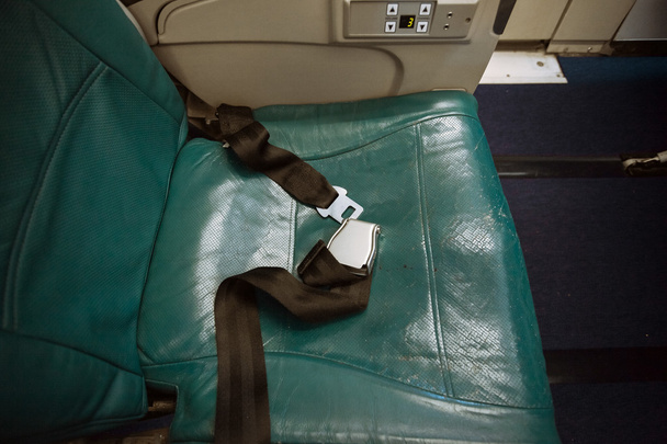 unfastened belt on seat at airplane - Photo, Image