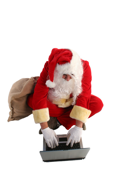 Weihnachtsmann arbeitet am Computer - Foto, Bild