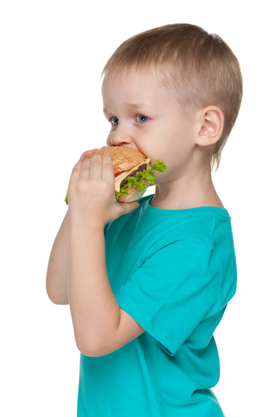 Маленький хлопчик з гамбургером
 - Фото, зображення