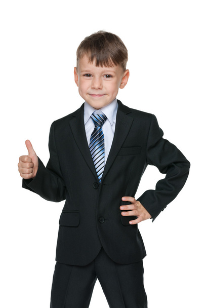 School boy holds his thumb up - Φωτογραφία, εικόνα