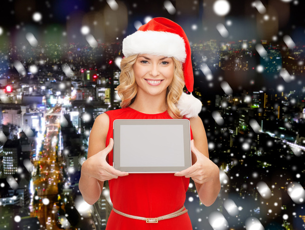 woman in santa helper hat with tablet pc - Photo, Image
