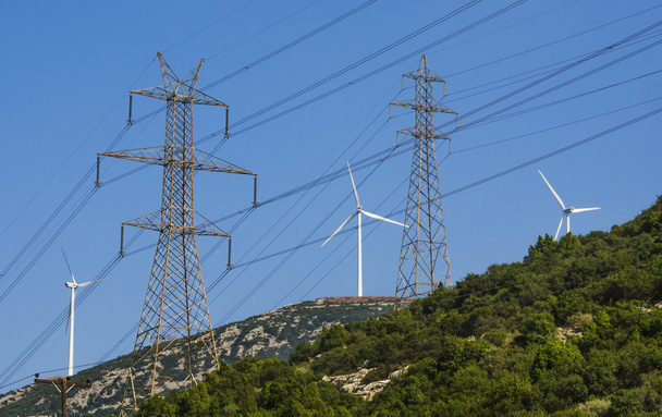 Wind turbines and electricity towers - Foto, Bild