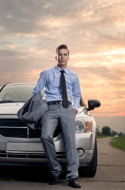Handsome young man leaning on his car - Photo, Image