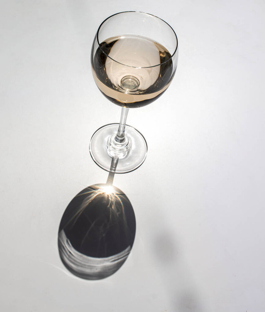 glass of wine and a bottle on a white background - Photo, Image