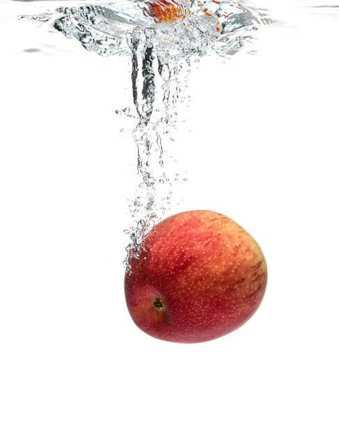 Red apple splashing into water  - Foto, Bild