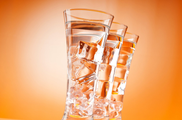 Water in the glass against gradient background - Foto, immagini