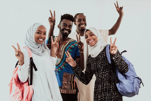 Group of happy african students having conversation and team meeting working together on homework girls wearing traidiional sudan muslim hijab fashion - Photo, image