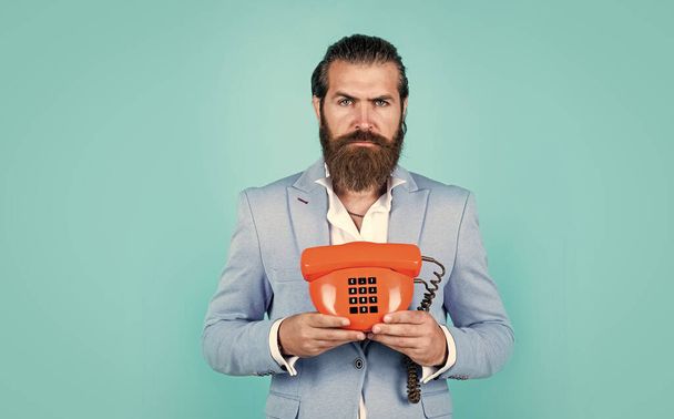Feel the connection. elegant businessman has business talk. communication. true gentleman with groomed hair hold vintage telephone. nice conversation. bearded man in formalwear speak on retro phone - Photo, image